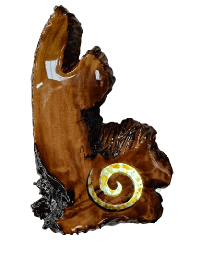 A Kauri root slice with a lit up amber koru.
